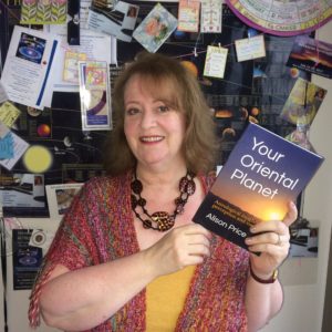 Alison holding her book Your Oriental Planet